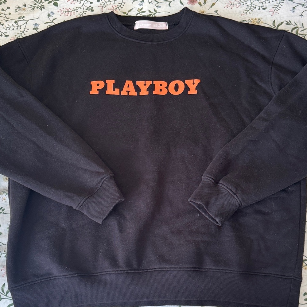 PLAYBOY Women's Black Sweater with Vibrant Orange Logo